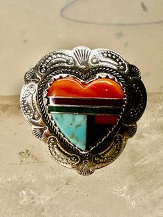 Heart ring Turquoise Coral southwest size 5.50 sterling silver girls women  Signed Q.T. Size 5.50 Between a size 5.50 and a size 5.75 Weight  4.2g Length  7/8" Width  3/4" Thinnest part of band in back  3/16" Free Shipping & Free Postal Insurance  Delivered in a Gift Box  Free First Class shipping and postal insurance is included. If you want to upgrade to priority kindly pay an additional fee to do so.  This is recommended if you would like to have your package delivered faster than first class Western Style Gemstone Rings For Gifts, Western Style Gemstone Ring Gift, Western Style Gemstone Ring As Gift, Southwestern Inlay Jewelry For Anniversary, Southwestern Style Inlay Jewelry For Anniversary, Southwestern Sterling Silver Rings For Anniversary, Adjustable Multi-stone Turquoise Ring In Silver, Adjustable Multi-stone Silver Turquoise Ring, Southwestern Multi-stone Jewelry For Anniversary