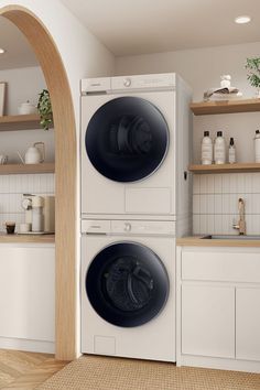 a washer and dryer in a white kitchen