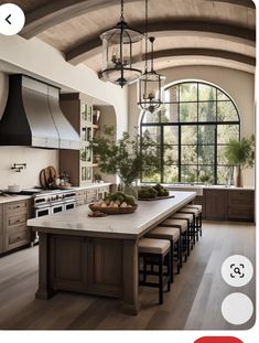 a large kitchen with an island and lots of counter space