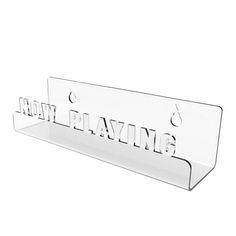 a clear acrylic sign that says how playing