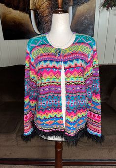 New W/Tags~ Design Options By Philip & Jane Gordon~ Size Small Multi-Colors Sequins Cardigan Sweater. This is a beautiful sweater with vibrant colors & sequins all over. It has fringe at ends of sleeves & hem. You can wear this cardigan to liven up any outfit . Details:  1.) Breast: 38" inches (loose fitting)  2.) Shoulder to shoulder: 15" inches  3.) Shoulder to hem: 22" inches  4.) Waist: 38" inches (stretches)  5.) Hip: 40" inches  6.) Sleeve length: 31" inches  7.) 1 button for closure  8.) Multicolor Fitted Bohemian Sweater, Tags Design, Sequin Cardigan, Sequin Sweater, Beautiful Sweater, Tag Design, Over It, Outfit Details, Cardigans For Women