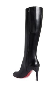 New to the maison's lineup of sleek, sophisticated footwear comes this timeless knee-high boot whose rounded toe balances the stiletto heel. Christian Louboutin's iconic red sole—born from a fateful brush with red nail lacquer—lends distinctive brilliance to every step. 3 1/2" (85mm) heel (size 38.5) 16" shaft; 14 1/4" calf circumference Side zip closure Wipe with a soft, dry cloth and store in a dust bag Please note the red lacquer on soles will wear off as a result of normal use. To minimize t Luxury Fitted Knee-high Boots For Work, Fitted Luxury Knee-high Boots For Work, Luxury Fitted Office Boots, Elegant High Shaft Platform Boots For Work, Luxury Fitted Knee-high Boots For Office, Modern Knee-high Heeled Boots For Evening, Modern Knee-high Heeled Boots For Formal Occasions, Elegant Leather High Shaft Platform Boots, Luxury Boots With Sculpted Heel For Office