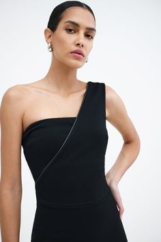 Our Nina Dress has got glamour with layers. She innovates the one-shoulder design in a tube top base lined with soft European mesh, crossed over by a diagonal layer with faux leather trim. Complete with a center-back zip, Nina's fashioned from soft, mid-stretch European ponte for all-night structure. [SPLIT] Astrid is 5'9" (175 cm) tall, wearing size XS. Total length approximately 41" (104 cm). European Ponte, also known as Punto di Roma (60% Viscose, 30% Polyamide, 10% Lycra). Vegan Leather (93 Structure Fashion, Structured Fashion, Im So Fancy, Top Base, The A Team, Shoulder Design, Leather Trim, Tube Top, Oasis