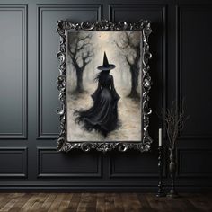 a painting hanging on the wall next to a candle