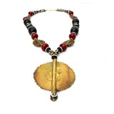 Beautiful black and maroon copal resin amber necklace with brass pendants. One of a kind authentic bold necklace. One size fits all. Neck drop 22" Luxury Traditional Bronze Necklace, Luxury Amber Spiritual Necklace, African Necklaces, Brass Pendants, Bold Necklace, African Necklace, Ethnic Necklaces, Amber Necklace, Necklace And Earring Set