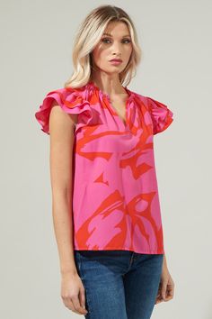 We're always in the mood for fun with the Jolene Abstract Bellissima Ruffle Sleeve Top! With a highlighting silhouette followed by a split neckline and ruffle cap sleeves. The bodice maintains a classic fit that can easily be styled tucked into a pair of high waisted shorts and loafers for a classic look.- Cap sleeves- Split - Ruffle layers - Relaxed fit- Color: Red FuchsiaSize + Fit - Model is 5'8" and wearing size XS- Measurements taken from size S - Chest: 19 1/4"- Length: 25" Fabric Self: 10 Chic Ruffled Split Neck Blouse, Chic Split Neck Blouse With Ruffles, Ruffle Sleeve Top, Ruffled Sleeve Top, Holiday Weekend, In The Mood, The Mood, High Waisted Shorts, Cap Sleeves