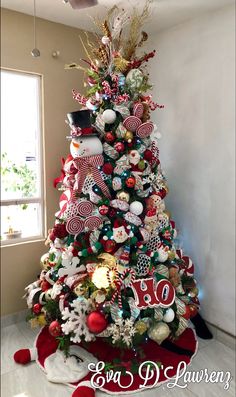 a christmas tree decorated with candy canes and ornaments