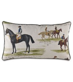 a pillow with horses and jockeys on it