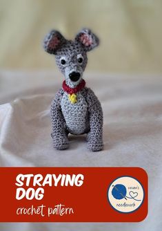 a small crocheted dog sitting on top of a white sheet with the words straving dog written below it