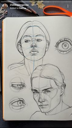 an open notebook with drawings of people's faces and eyes on the cover, along with scissors