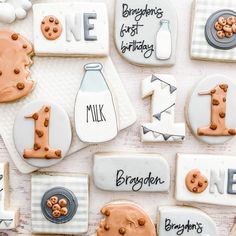 decorated cookies are arranged in the shape of letters and numbers, including one for milk