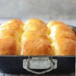 a pan filled with bread sitting on top of a counter