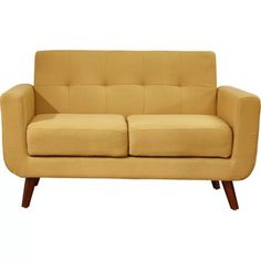 a tan couch sitting on top of a wooden frame