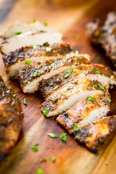 grilled pork chops on a wooden cutting board