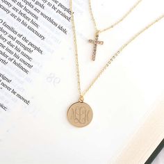 We think that our Monogrammed Layered Cross Necklace is an essential jewelry piece. We’ve updated the classic cross necklace style with this double necklace design — and with a monogram, of course! Consider gifting this beautiful piece for Mother’s Day, holidays, confirmations and more.The inner 16-inch chain features a rhinestone-encrusted cross; the outer 18-inch chain includes our classic disc-style charm, which will be engraved with your favorite monogram. This double Elegant Personalized Cross Necklace, Layered Necklaces Cross, Muktilayered Cross Necklace, Dainty Gold-plated Cross Necklace Gift, Gold-tone Cross Necklace Gold Plated, Layered Cross Necklace, Essential Jewelry, Personalized Cross Necklace, Disc Style