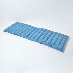 a blue sleeping bag on a white background