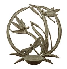 a metal sculpture with dragonflys on it