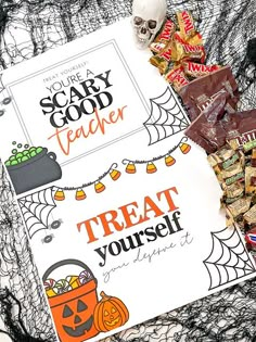 halloween treats and candy on a table with a scary book cover in the background that says, you're scary teacher treat yourself