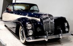 an antique car on display in a museum