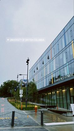 the university of british columbia building is shown in this photo, with an empty street