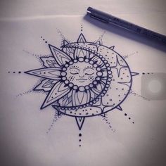 a drawing of a sun with a face on it's side, sitting next to a pen