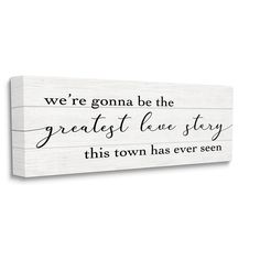 a wooden sign that says we're going to the greatest love story this town has ever seen