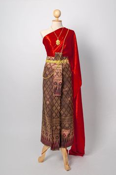 "This is Asian traditional dress is made from synthetic silk for top and skirt (adjust size by hook), length 36 inches. This dress set including with one sabai and one sarong . It is very unique and easy to wear. This item we have 2 type size. 1. Standard size Waist 23-30\" Hip max. 37 \" 2 Plus size Waist \" up to 42\" Hip up to 46\" Item not include jewelry, or accessory Note: - Each item may have very slight variances and imperfections due to the handmade process - The actual color may be sli Lao Clothing, Traditional Thai Dress, Thai Traditional Clothing, Laos Clothing, Traditional Thai Clothing, Thai Wedding Dress, Thai Fashion, Thai Clothes, Thai Wedding