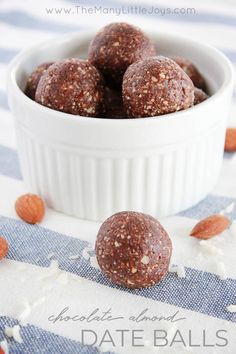 chocolate almond date balls in a white bowl