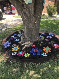 a tree has been decorated with buttons and flowers in the shape of hearts on it