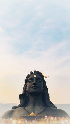 there is a large statue in the middle of a field