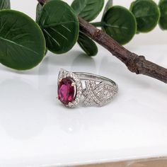 This stunning ring features a beautiful 1.28 carat rubellite tourmaline gemstone framed by a natural earth mined diamond halo in a vintage style design. A beautiful collection piece that is perfect for every occasion. 💕 This ring is made with solid 14K Gold and natural Earth mined SI / G-H diamonds. As listed, this ring is ready to ship. If you're interested in purchasing this setting with a different center stone please message us! Luxury Tourmaline Birthstone Ring For Wedding, Luxury Birthstone Open Ring Jewelry, Luxury Oval Tourmaline Birthstone Ring, Luxury Halo Setting Stackable Round Rings, Phone Items, Rubellite Tourmaline, Tourmaline Ring, October Birthstone, Tourmaline Gemstone