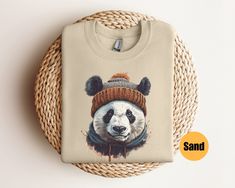 "Panda Bear Sweatshirt | Panda Mom Shirt | Vintage Panda Outfit | Y2K Graphic Sweatshirt |  Panda Sweater | Gift For Him | Gift For Her Matching T-Shirt: https://printworkshopcompany.etsy.com/listing/1627359918/panda-graphic-tee-cute-panda-bear-shirt ** HOW TO ORDER 1. Check our photos for sizing and color options.  2. Select your size and color from the drop-down menus.  3. In personalization box fill out name to be printed 4. Click \"ADD TO CART\" to add the shirt to your cart. 5. Click \"PROCEED TO CHECKOUT\" to purchase your shirt. ** VIP Email List Be sure to join our VIP Email list for new product releases, special promotions, and giveaways! https://email.everbee.io/subscribe?shopName=PrintWorkshopCompany ** PRODUCTION TIME: 1-3 days (Usually 2 days) ** SHIPPING TIME: 2-5 days (Usual Winter Graphic Print Short Sleeve Sweatshirt, Panda Sweater, Panda Outfit, Panda Graphic, Panda Shirt, Bear Sweatshirt, Bear Shirt, Sweater Gift, Mama Shirts