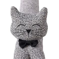 a cat made out of silver sequins with a black bow tie