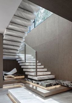 the stairs in this modern house are made of marble