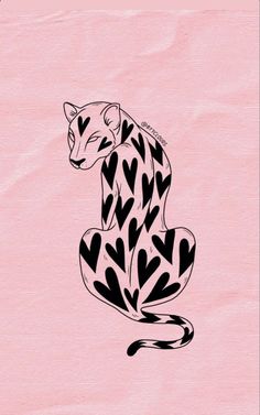 a black and white cheetah sitting on top of a pink paper with hearts