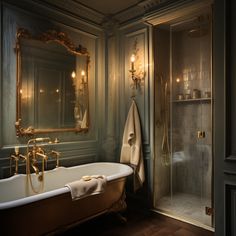 an old fashioned bathtub and shower in a bathroom with gold fixtures on the walls