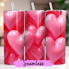 three cups with straws in the shape of hearts