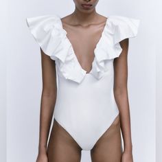 Genuine Zara New With Tag Material: Color: White Dramatic Ruffled Neckline Gives Interest To Basic White Bodysuit. Looks Great With Various Bottoms Summer Ruffled V-neck Bodysuit, Fitted Ruffle Bodysuit For Vacation, Elegant Fitted Bodysuit With Ruffles, Elegant Fitted Ruffle Bodysuit, Elegant Fitted Ruffles Bodysuit, Chic Fitted Bodysuit With Ruffles, Chic Sleeveless Bodysuit For Brunch, Feminine Ruffle Bodysuit For Parties, Chic Fitted Ruffles Bodysuit