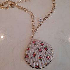 Beautiful And Fun Betsey Johnson 'Shell Yeah' Seashell Necklace - New With Tags - Gold Tone Necklace - White Gray Seashell Pendant - Delicate Floral Print - Gold Tone Curb Link Chain Features A Gold Tone Metal Seashell Pendant With White Gray Enamel And Multicolored Delicate Floral Print On Front Of Seashell. - Round Blush Pink Crystal Accents Dotted Around Front Of Seashell. - Dangling On One Side Of Chain Is A Gold Tone & White Resin Tropical Flower Charm With A Pink Crystal Accent In Center O White Metal Necklaces For The Beach, White Flower Metal Necklaces, White Metal Flower Necklace, White Flower Metal Necklace, White Chain Necklace For Beach, White Chain Necklace For The Beach, White Flower Charm Necklace For The Beach, White Flower Charm Necklace For Beach, Elegant Flower Necklace For Beach