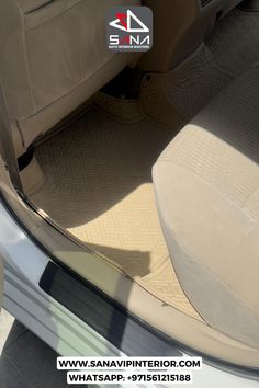 the interior of a car with beige carpet