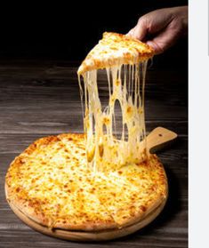 a person taking a slice of cheese pizza