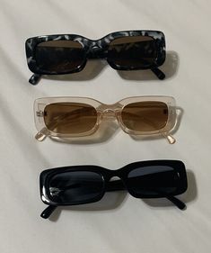 Enhance your beach or retro-style look with these three pairs of small square frame sunglasses. These fashionable sunglasses feature tinted lenses of black and brown colors. The plastic frame material makes them lightweight and easy to carry around. The multicolor frame color adds a touch of uniqueness to your style, making them perfect for teens and women. These vintage sunglasses are perfect for a 90s themed party or a day out in the sun. The temple length is 5.5 inches, and they offer UV protection for your eyes. Includes pair of black, black tortoise shell and beige glasses.  Total of 3 pair of sunglasses at an amazing price.   1st pic has a glare I can't get out with iphone  Size & Fit Product Measurements Bridge Lens Height Lens Width Temple Length 0.8 1.3 2 5.5 Beige Glasses, Sunglasses Women Summer, Oversized Cable Knit Sweater, Summer Punk, Sunglasses Aesthetic, Fashionable Sunglasses, Square Frame Sunglasses, Black Tortoise, Sunglasses Women Vintage