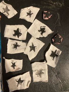 several pieces of cloth with black and white stars on them