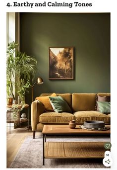 a living room with green walls and couches, coffee table and potted plant