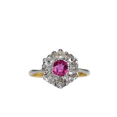 a pink and white diamond ring on a white background