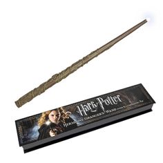 a harry potter wand is on display next to a box