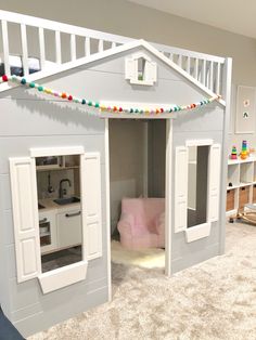 there is a doll house made to look like it has been built into the floor