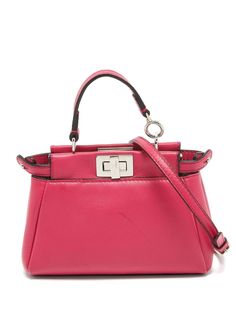 circa 2015 fuchsia pink leather single top handle adjustable detachable shoulder strap twist-lock fastening main compartment silver-tone hardware This piece comes complete with a protective dust bag. Condition: GOOD. This previously owned and used item is in good condition with minimal signs of use. This may include fading of material or plating and scratches. Fendi 2015, Fendi Micro Peekaboo, Peekaboo Bag, Fuchsia Pink, Orange Leather, Peek A Boo, A Well, Pink Leather, Pink Bag