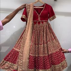 This Is A Brand New Never Been Worn Wedding Lehenga From Benzer In Mumbai. It Is Customized Measurement Size 42 In Length. Skirt Is Georgette Material With Beautiful Detailed Handwork. Blouse Is Raw Silk With Deep V Neck. Dupatta Is Beige Net. Also Have A Red Dupatta. Skirt Has Cancan And Blouse Is Padded. Room To Open Blouse If Needed. Would Fit 32-34 Bra Size. Traditional Red Gown For Marriage, Traditional Red Dress For Marriage, Traditional Red Marriage Dress, Elegant Red Traditional Wear For Ceremony, Long Embroidered Choli For Wedding, Embroidered Long Choli For Wedding, Floor-length Marriage Sets With Intricate Embroidery, Floor-length Sets With Intricate Embroidery For Marriage, Festive Traditional Drape Dress For Marriage