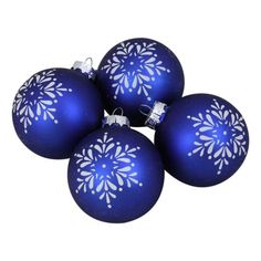 four blue christmas ornaments with white snowflakes on the top, and one in the middle